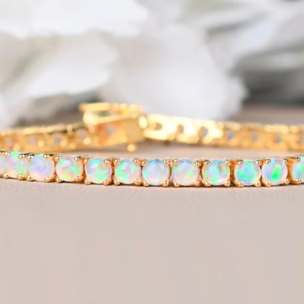 Yellow gold opal tennis bracelet